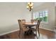 Cozy dining room with hardwood floors and natural light from the window at 3325 W 111Th Loop # C, Westminster, CO 80031