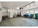 Spacious garage featuring ample storage space, a refrigerator, and a functional work area at 3325 W 111Th Loop # C, Westminster, CO 80031