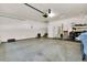 Spacious two car garage with white walls and concrete flooring, offering ample space for parking and storage at 3325 W 111Th Loop # C, Westminster, CO 80031
