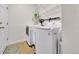 Practical laundry room features a modern washer, dryer, and ample shelving at 3325 W 111Th Loop # C, Westminster, CO 80031