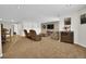 Spacious living room with a TV, plush seating, and soft carpeting at 3325 W 111Th Loop # C, Westminster, CO 80031