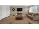 Neutral living room featuring a comfortable sofa, shutters, and a decorative wooden coffee table at 3325 W 111Th Loop # C, Westminster, CO 80031