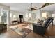 Living room featuring hardwood floors, a ceiling fan, and ample natural light at 3325 W 111Th Loop # C, Westminster, CO 80031