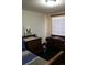 A second view of the bedroom showcasing matching dressers on either side of the bed at 933 Skeel St, Brighton, CO 80601