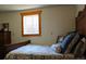 Charming bedroom featuring a cozy bed and view from the window at 933 Skeel St, Brighton, CO 80601