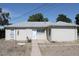Charming single-story home featuring a well-maintained exterior and neutral-colored siding at 933 Skeel St, Brighton, CO 80601
