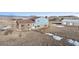 Aerial view of a two-story home and large garage on expansive land with a mountain view at 12990 Mesa View Rd, Larkspur, CO 80118