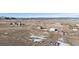Wide angle aerial showcasing home in a pastoral setting with utility buildings on spacious land at 12990 Mesa View Rd, Larkspur, CO 80118