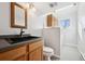 Bathroom with updated vanity, countertop, and lighting at 12990 Mesa View Rd, Larkspur, CO 80118