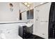 Bathroom with a sink, mirror, and walk-in shower at 12990 Mesa View Rd, Larkspur, CO 80118