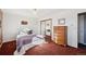 Bedroom with closet and dresser at 12990 Mesa View Rd, Larkspur, CO 80118