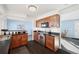 Modern kitchen with wood cabinets, stainless steel appliances, and plenty of counter space for food preparation at 12990 Mesa View Rd, Larkspur, CO 80118
