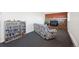 Cozy living room features a brick fireplace and convenient shelving at 12990 Mesa View Rd, Larkspur, CO 80118
