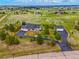 Expansive aerial view of a luxurious home with an attached and detached garage on a large, green lot at 34682 Stampede Cir, Elizabeth, CO 80107