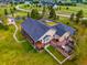 Aerial perspective of the home, highlighting a two-story deck and meticulously landscaped backyard with a pristine lawn at 34682 Stampede Cir, Elizabeth, CO 80107