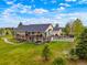 An aerial view showcasing the spacious backyard with a multilevel deck and patio, perfect for outdoor entertainment at 34682 Stampede Cir, Elizabeth, CO 80107