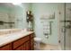 The bathroom features a granite vanity, soft lighting, and glass enclosed shower at 34682 Stampede Cir, Elizabeth, CO 80107