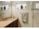 Well-lit bathroom featuring a glass-door shower, stylish vanity, and serene decor for a spa-like feel at 34682 Stampede Cir, Elizabeth, CO 80107