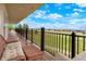 Covered deck features comfortable seating and scenic views of the surrounding landscape at 34682 Stampede Cir, Elizabeth, CO 80107