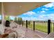 Relax on the covered deck and enjoy the panoramic views from the comfortable wicker seating at 34682 Stampede Cir, Elizabeth, CO 80107