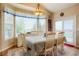 Cozy dining area with a Tiffany-style lamp, a view of the property, and direct access to the outdoors at 34682 Stampede Cir, Elizabeth, CO 80107
