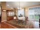 Charming dining room featuring hardwood floors and a sliding door to a balcony at 34682 Stampede Cir, Elizabeth, CO 80107