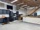 Organized garage with storage cabinets, workspace, and high ceilings, offering versatile utility at 34682 Stampede Cir, Elizabeth, CO 80107