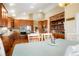 Spacious kitchen features stainless appliances, granite countertops and hardwood floors at 34682 Stampede Cir, Elizabeth, CO 80107