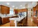 Stylish kitchen featuring granite countertops, stainless steel appliances, and wooden cabinets at 34682 Stampede Cir, Elizabeth, CO 80107