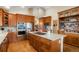 Spacious kitchen with a large island, stainless steel appliances, and ample counter space at 34682 Stampede Cir, Elizabeth, CO 80107