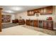Stylish basement living area with a wet bar, wine coolers, and comfortable seating at 34682 Stampede Cir, Elizabeth, CO 80107