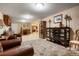 Finished basement with a living area, desk, display cases, and comfortable seating at 34682 Stampede Cir, Elizabeth, CO 80107