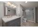 Updated bathroom with granite vanity and glass shower at 3327 Irving St, Denver, CO 80211