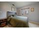 Neutral bedroom with window view and hardwood trim at 3327 Irving St, Denver, CO 80211