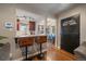 Breakfast bar featuring hardwood floors and views to the dining area at 3327 Irving St, Denver, CO 80211