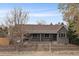 Charming one-story home with a brick facade, a covered porch, and a well-manicured front yard at 3327 Irving St, Denver, CO 80211