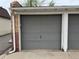 A gray panel garage door providing secure and convenient access to parking and storage space at 3327 Irving St, Denver, CO 80211