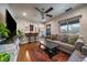 Relaxing living room with hardwood floors open to the breakfast bar and kitchen at 3327 Irving St, Denver, CO 80211