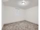 The basement bedroom has gray carpet, white walls, base trim, and a window at 3385 Olive St, Denver, CO 80207