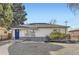 Inviting single-story home featuring well-manicured landscaping and charming curb appeal at 3385 Olive St, Denver, CO 80207