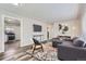 Inviting living room with hardwood floors, a neutral color scheme, and stylish furnishings at 3385 Olive St, Denver, CO 80207