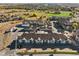 Aerial view of the townhome community showcasing well-maintained landscaping and parking areas at 18633 Stroh Rd # 2-104, Parker, CO 80134