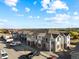 Aerial view of townhome community showcasing well-maintained landscaping and ample parking at 18633 Stroh Rd # 2-104, Parker, CO 80134