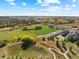 Aerial view of the community with lush green surroundings and a large recreational field at 18633 Stroh Rd # 2-104, Parker, CO 80134