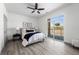Serene bedroom with large windows and door and a neutral palette, offering a relaxing retreat at 18633 Stroh Rd # 2-104, Parker, CO 80134