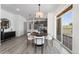 Charming dining room with a round table, stylish chairs, and a sliding glass door to the outside at 18633 Stroh Rd # 2-104, Parker, CO 80134