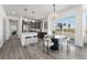 Modern kitchen with stainless steel appliances, granite countertops, and an adjacent dining area at 18633 Stroh Rd # 2-104, Parker, CO 80134