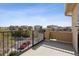 Private balcony with black metal railings offers neighborhood views and outdoor relaxation at 9456 Rockhurst St # F, Highlands Ranch, CO 80129