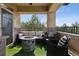 Relaxing outdoor balcony featuring a stone fire pit, comfortable seating, and artificial turf for a cozy atmosphere at 9456 Rockhurst St # F, Highlands Ranch, CO 80129