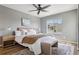 Serene bedroom with a comfortable bed, ample natural light, and stylish decor for a relaxing retreat at 9456 Rockhurst St # F, Highlands Ranch, CO 80129